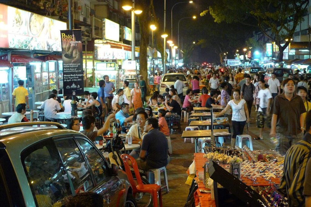 Crowded outdoor restaurants in Jalan Alor Night Market, Kuala Lumpur, Malaysia