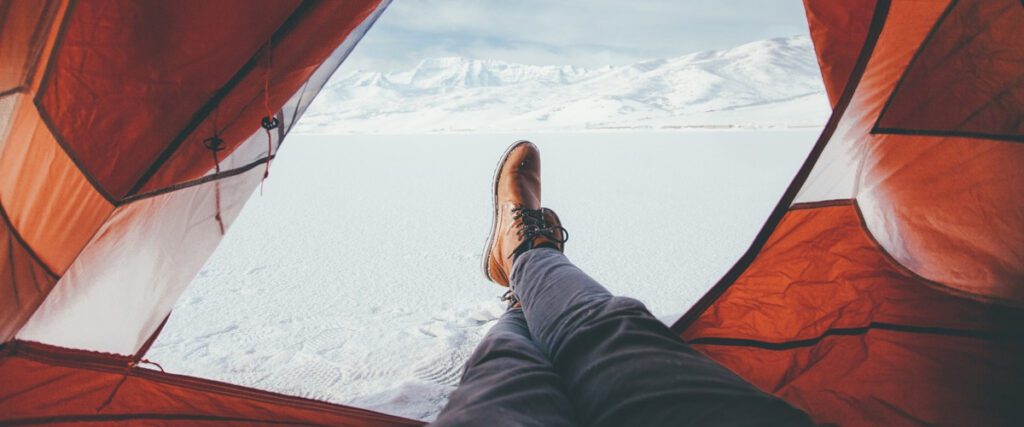 Winter camping: Laying in tent, looking out, photography