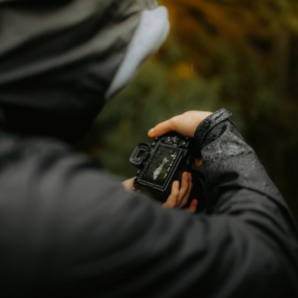 Man in the Rain with Camera